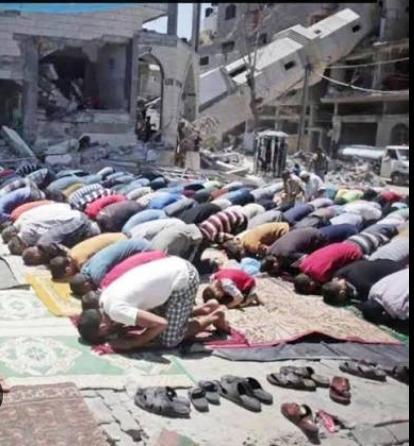 Faithful worshipping outside a burnt mosque - GPRFO tracks all faiths equally